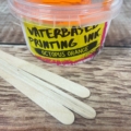 Octopus Orange waterbased screen printing ink, image of the tub with wooden sticks