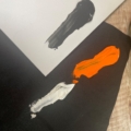 ink swatch of orange white and black ink
