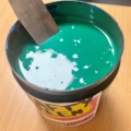 emulsion with open lid and spatula